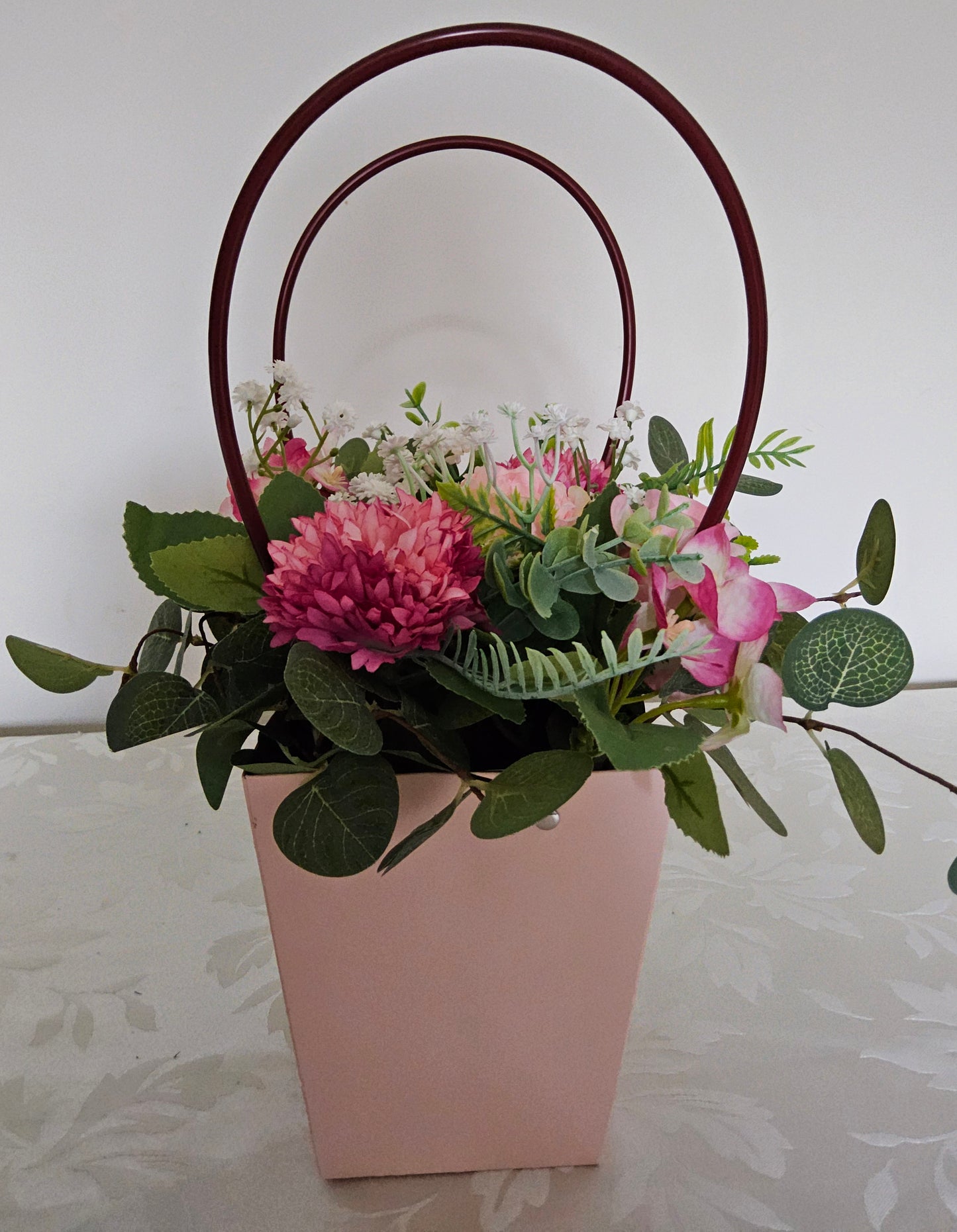 Out in the Town with these flowers in a pink handbag