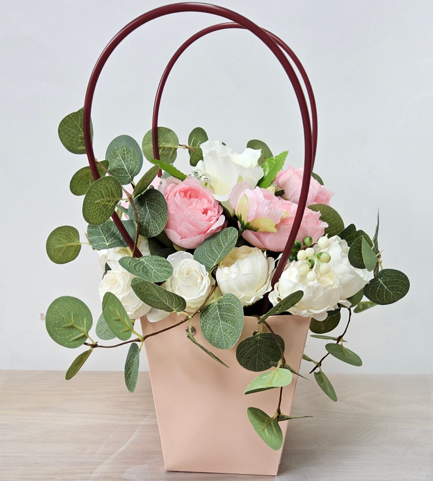 Pink Delight (faux flowers in a handbag shaped flower holder
