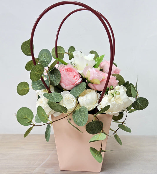 Pink Delight  (faux flowers in a handbag shaped flower holder